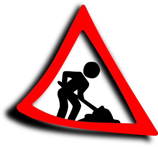 Área de trabajo. Se ve una ilustración de la señal triangular con borde rojo y fondo blanco, en la que hay un pictograma de un obrero trabajando: Pelibro por obras. 